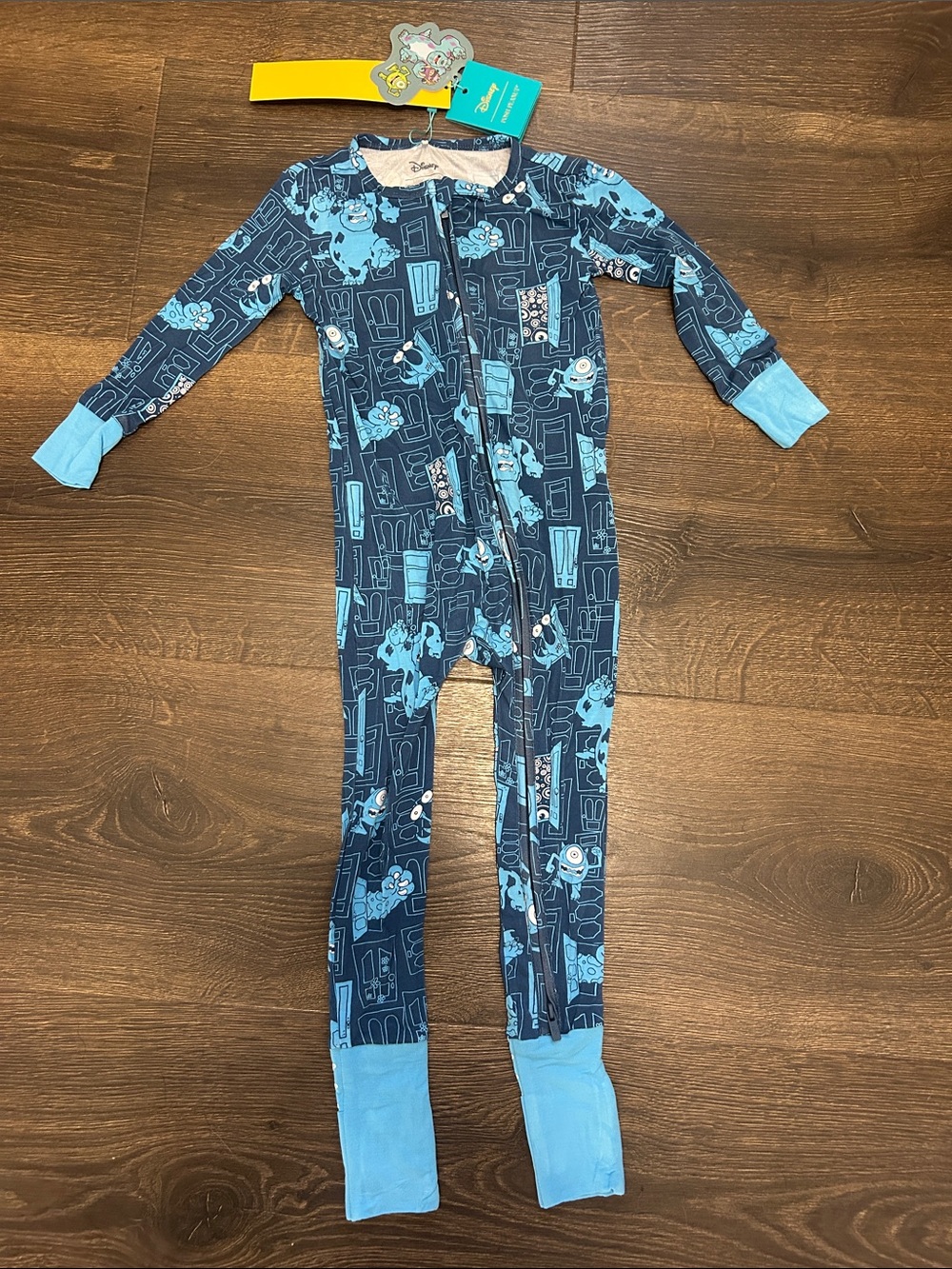 Posh Peanut Navy and Light Blue Monsters Inc One-Piece Footed Pajama - 18-24M